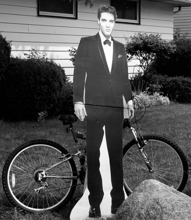 elvis on the corner w bike bw